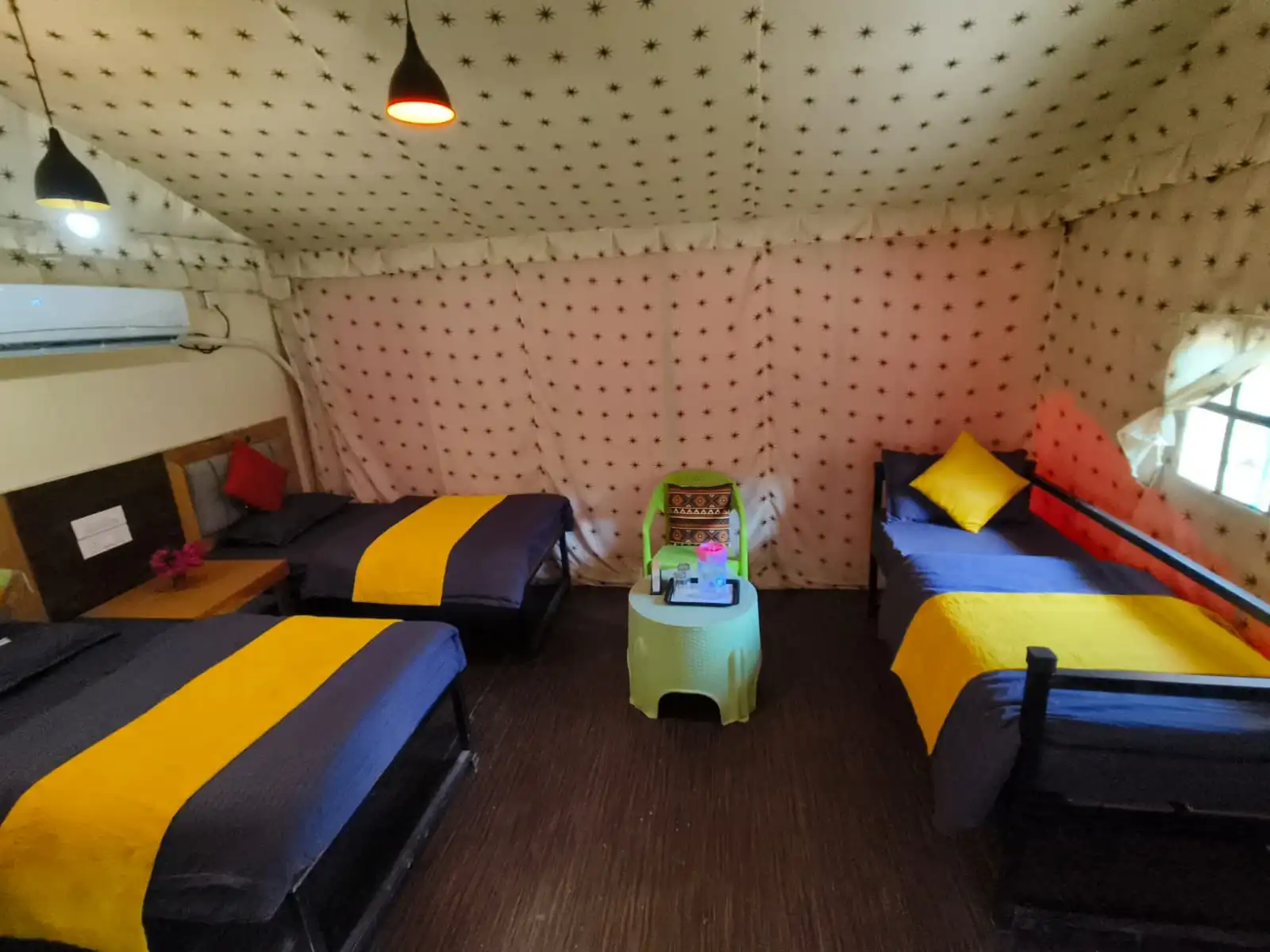 RS05 cottage room interior with multiple beds for group camping in Rishikesh