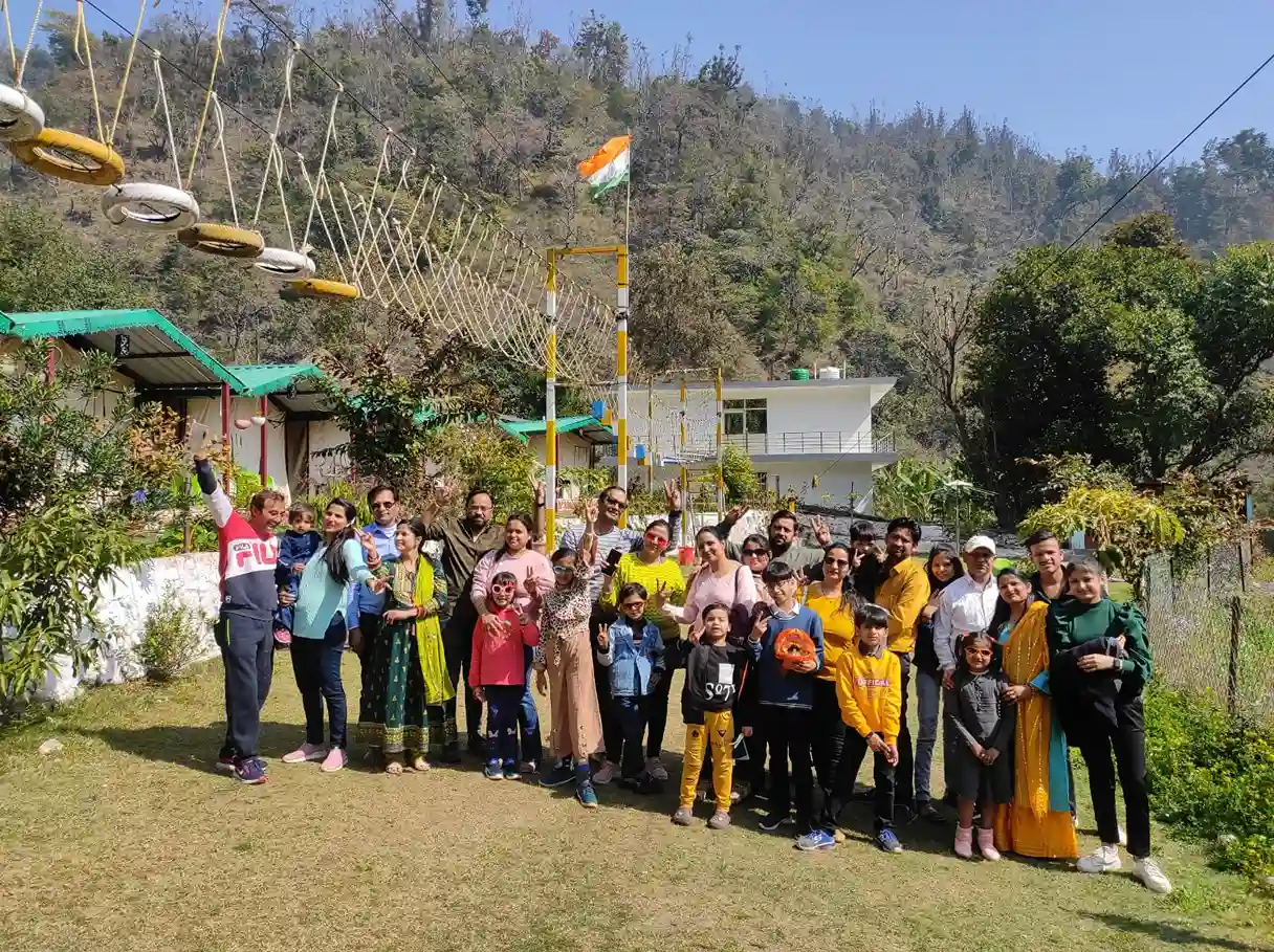 Happy group of families and kids enjoying outdoor activities at CampNStay RS06 Rishikesh