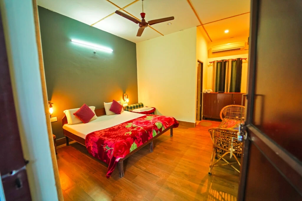 Cozy deluxe room with modern lighting and wooden flooring at RS08 resort