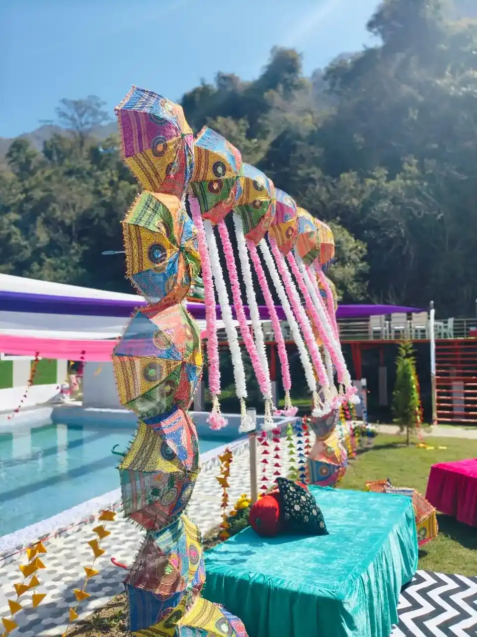 Colorful poolside wedding decoration at RS01 resort in Rishikesh with mountain view