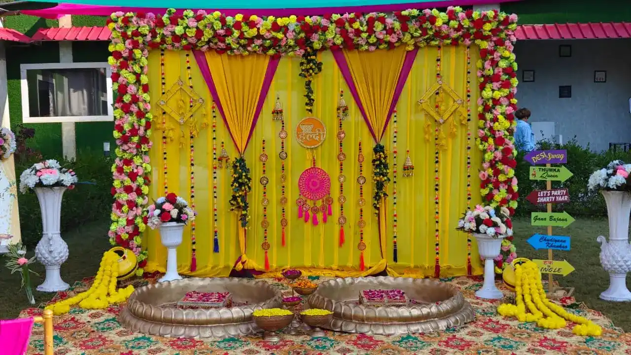 Haldi ceremony decoration setup at RS01 resort in Rishikesh with traditional floral backdrop