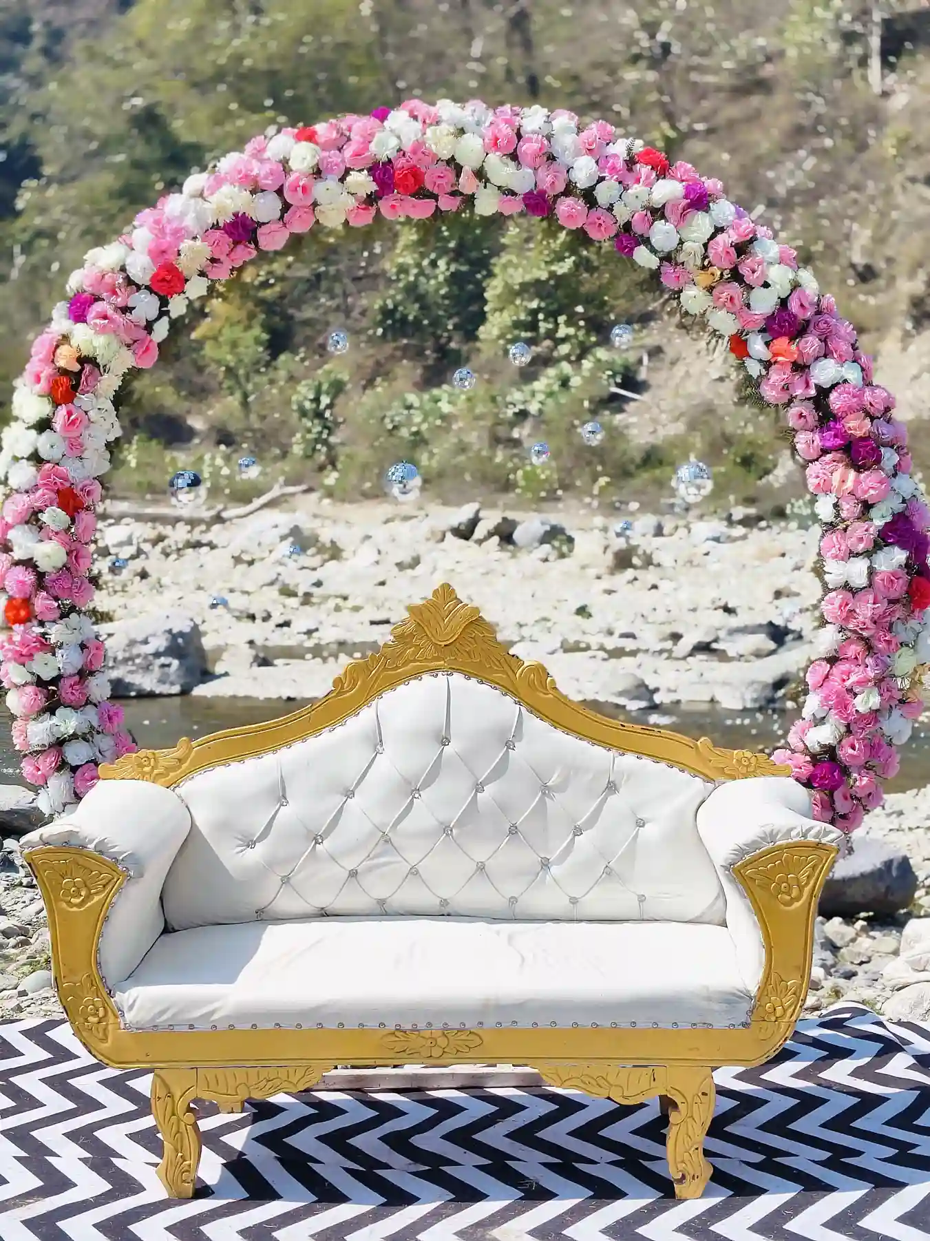 Floral wedding stage sofa with arch décor at RS01 riverside resort in Rishikesh