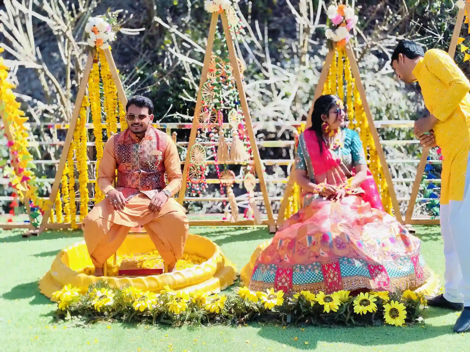 Couple enjoying haldi ceremony celebration at RS01 resort with family and friends