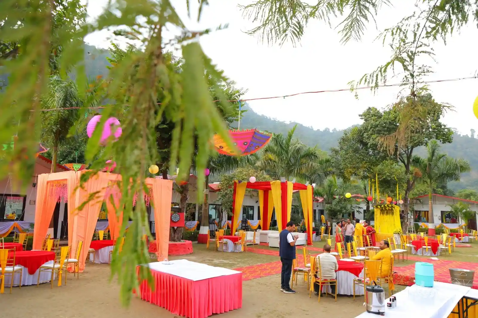 Destination wedding setup at RS04 resort in Rishikesh with colorful decor, garden seating and mountain views