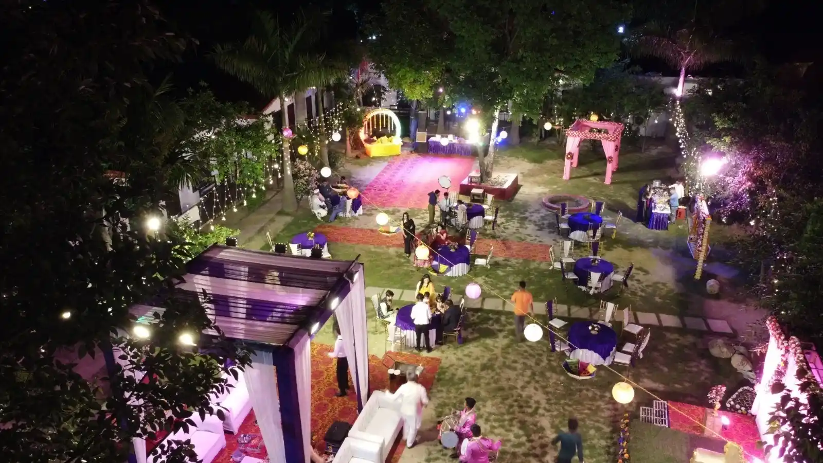 Evening destination wedding celebration at RS08 resort in Rishikesh with decorative lighting and guest seating