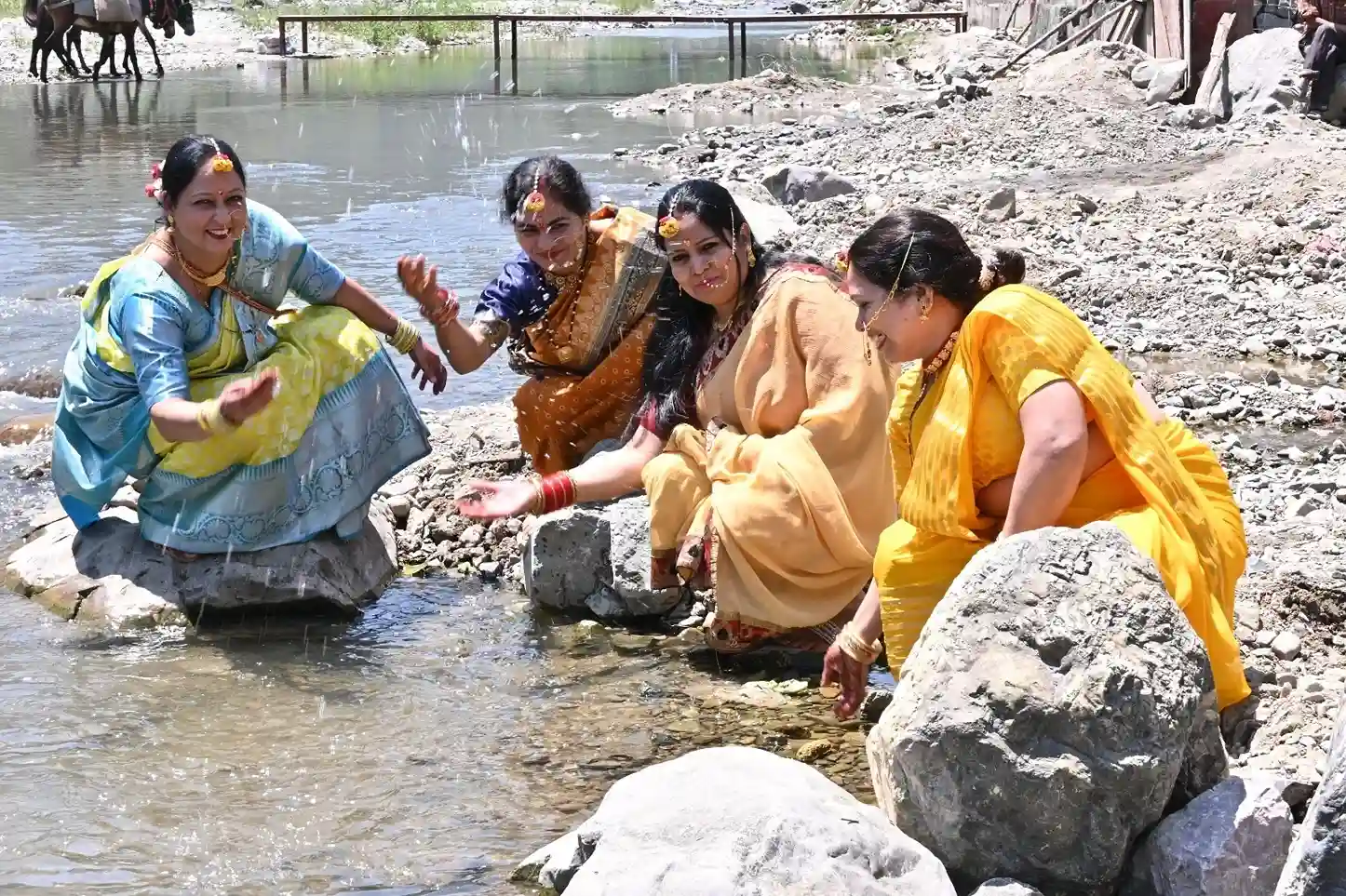 Haldi ceremony ritual by riverside at RS08 resort in Rishikesh with family enjoying traditional wedding customs